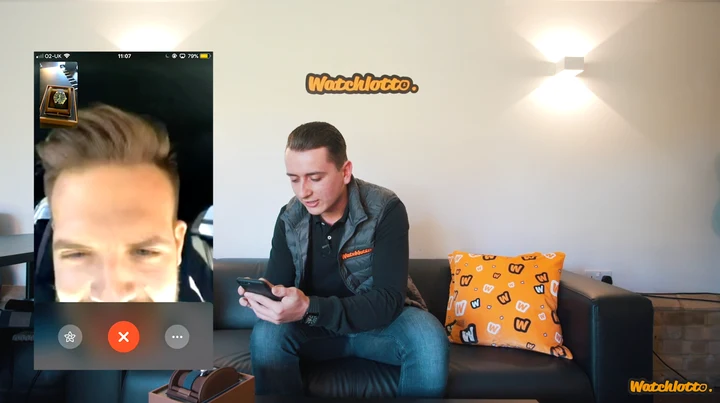 Harrison Gwinnett on the Watchlotto sofa speaking to a winner on a video call